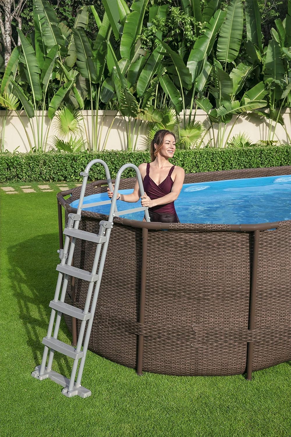 56946 Power Steel? Swim Vista oval pool 488 x 305 x 107 cm rattan pattern with portholes, sand filtration, ladder, cover and Chemconnect? diffuser